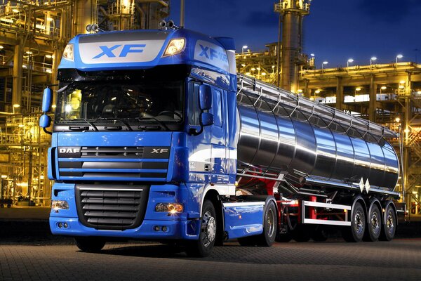 A fuel truck on the evening streets of the city