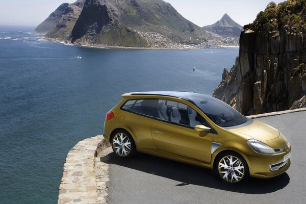 Renault clio on presentation on the sea with mountains