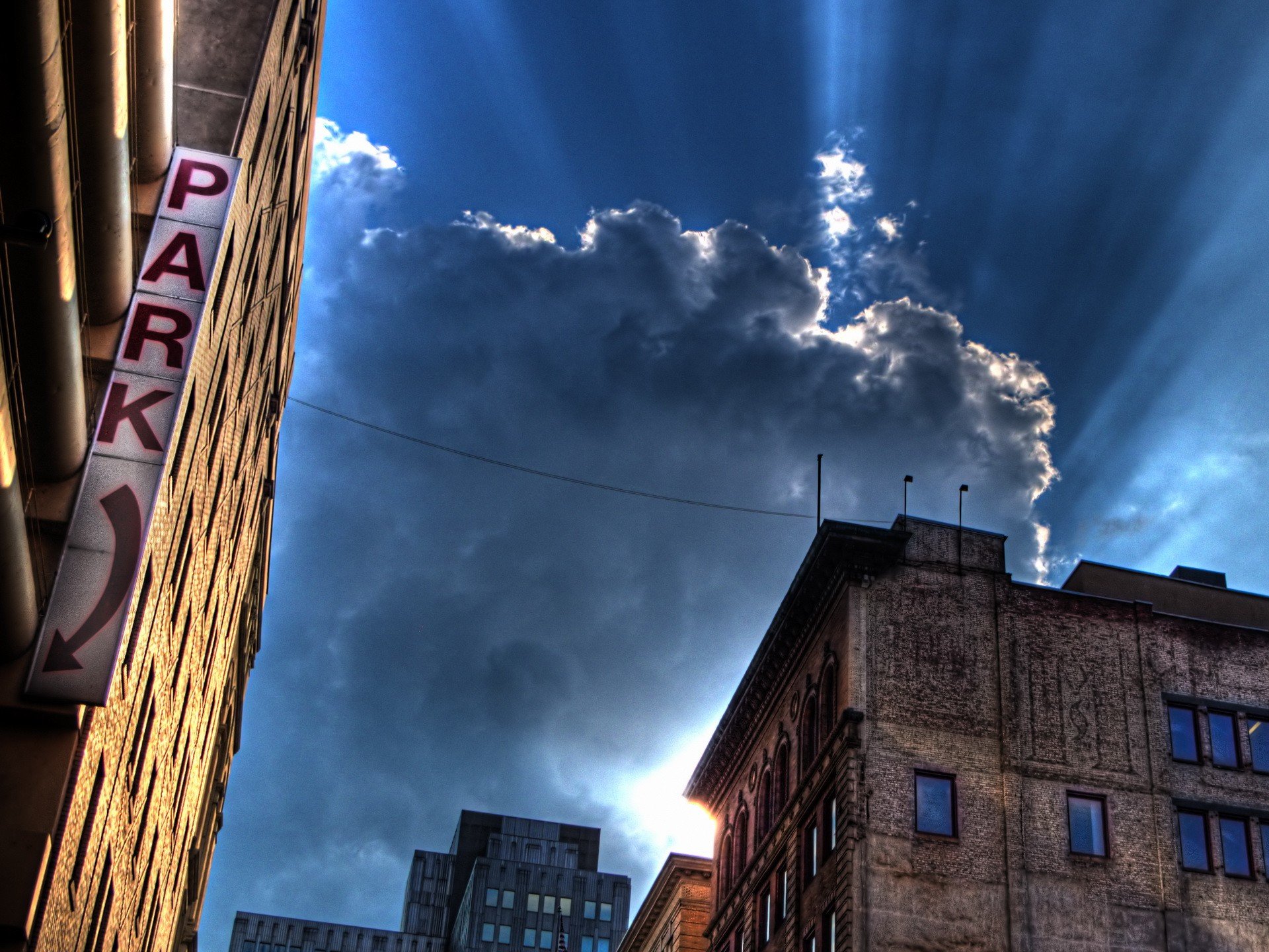 house buildings a sign clouds light