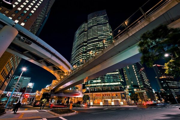 Night road between multi-storey buildings