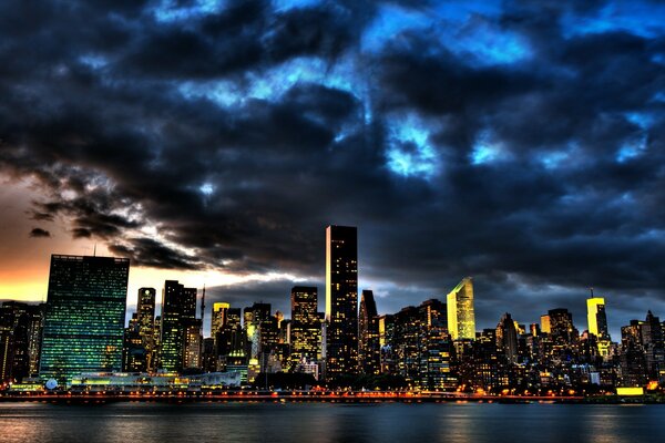 Storm clouds over skyscrapers at night