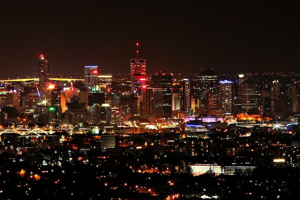 View of the lights of the night city from the height of a multi-storey skyscraper