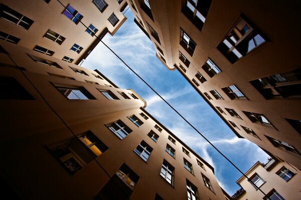 View of the sky from the well of buildings