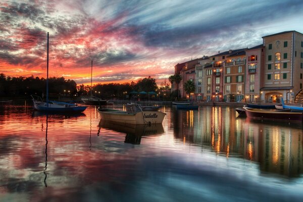 Extraordinary sky and houses in the reflection of water