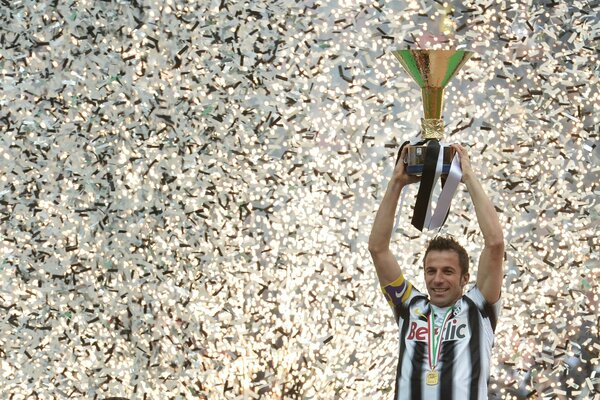 Italy, the winner holds the cup in his hands