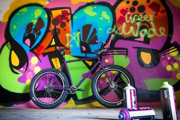 Bicycle on the background of graffiti on the wall