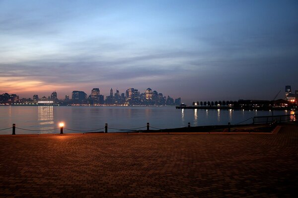 The embankment of the city at dusk. Moonwalk