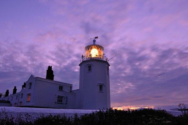 Evening lighthouse in lilac tones