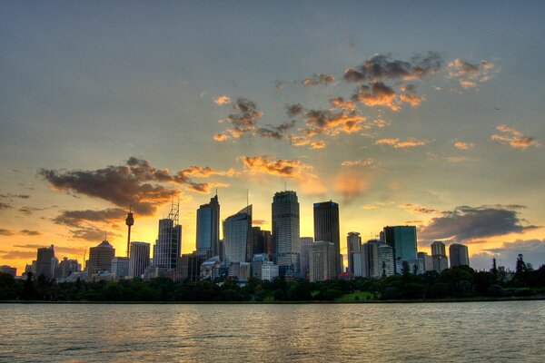 Dawn over the tall skyscrapers by the river