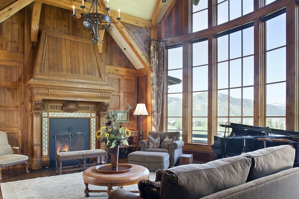 Large room with fireplace with mountain view