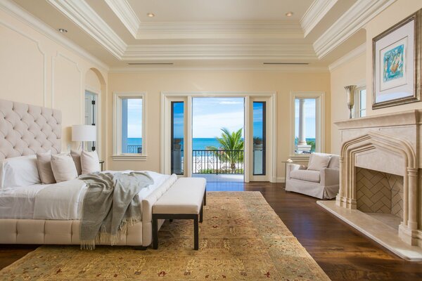 Bright living room with a large pull-out sofa and ocean view