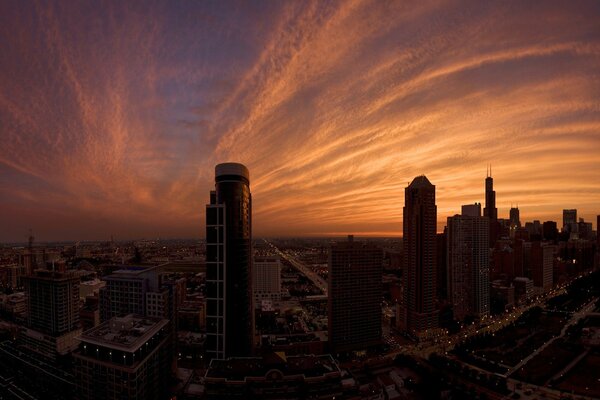 Photos of multi-storey buildings at sunset