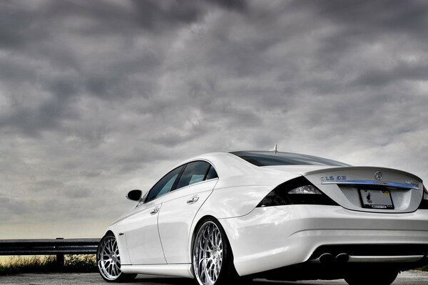 A decent luxury car. White Mercedes