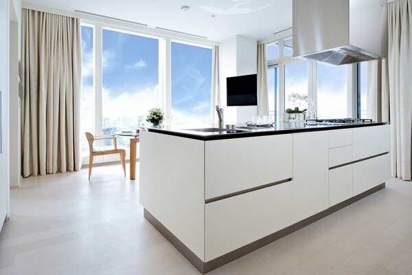 Modern prestigious white kitchen with panoramic windows