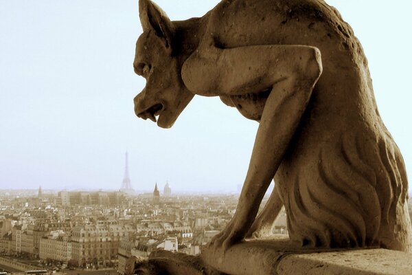 Statue on the background of the city in Paris