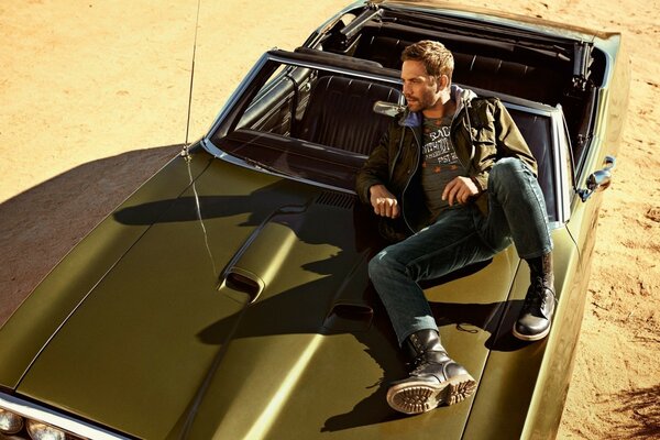 Actor Paul Walker sits in a car for filming