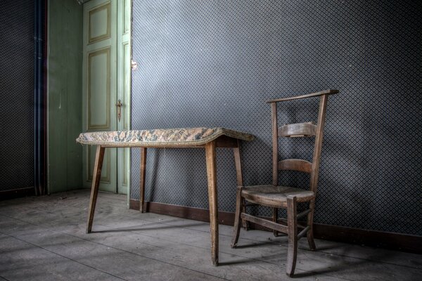 A half-empty room with a chair and a table