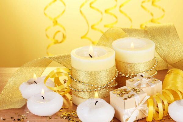 Golden confetti and burning candles