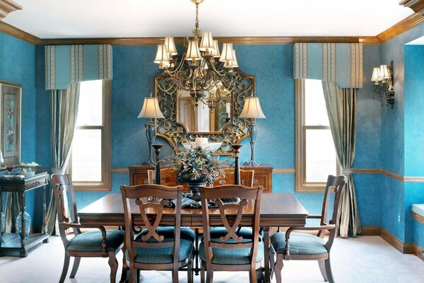 Turquoise dining room with table and chairs