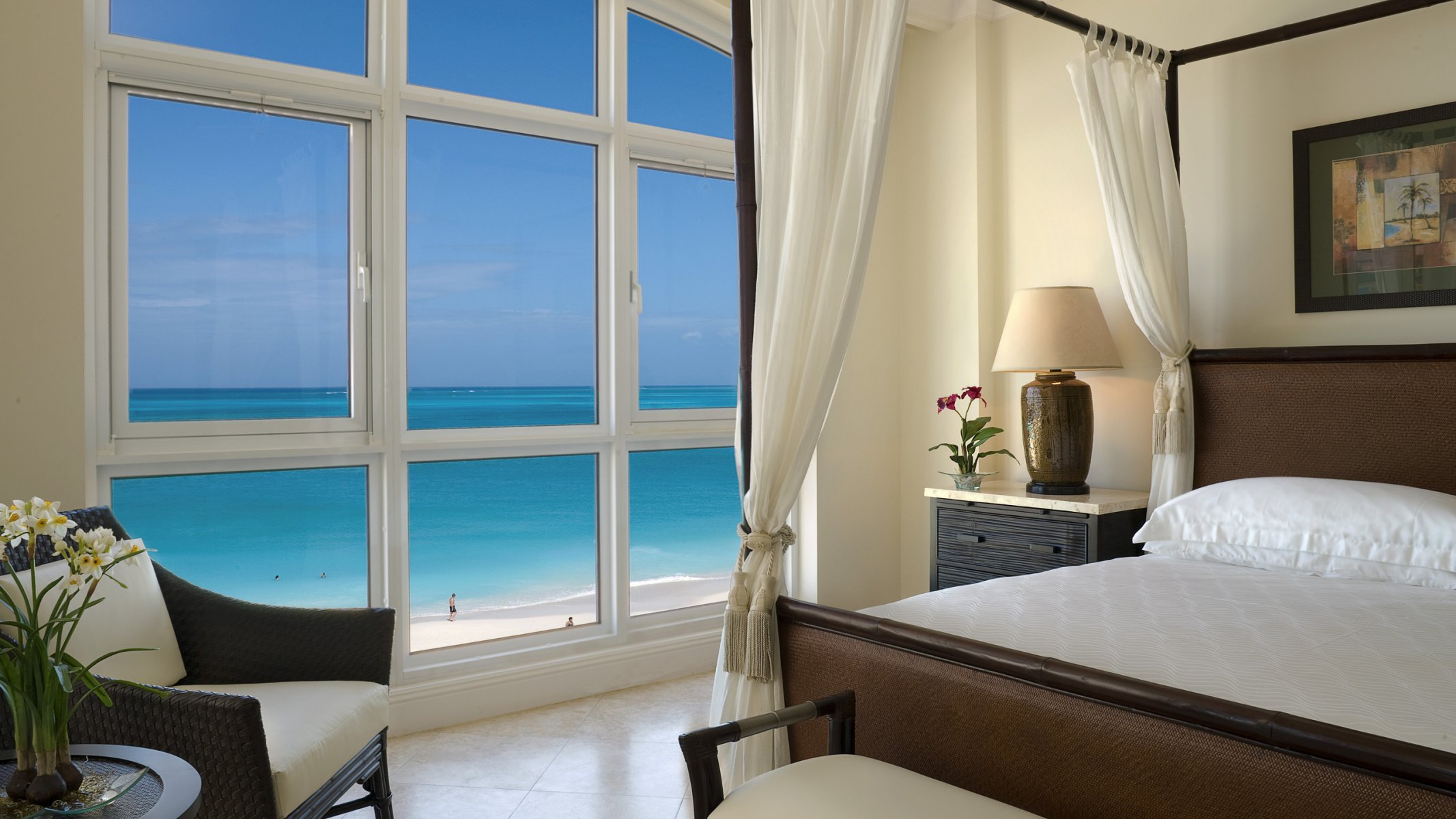 room bed chair window beach ocean