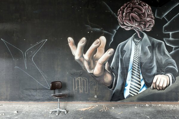 Graffiti de un hombre con cerebro en lugar de cabeza