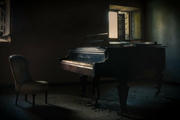 Dark room, piano and chair