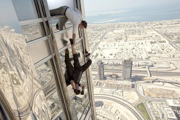 The man almost fell out of the window of a skyscraper