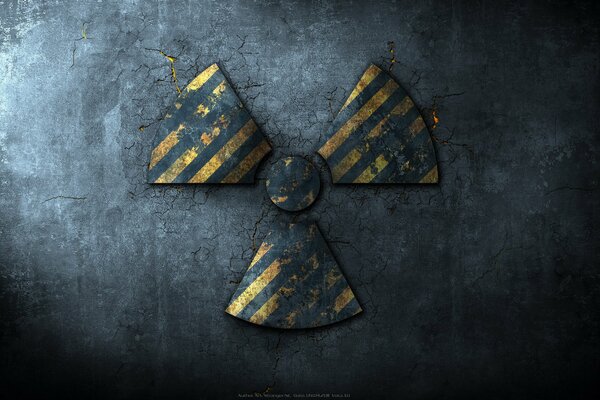 Radiation sign on cracked asphalt background