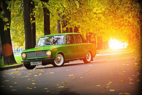 Green Zhiguli on the autumn road