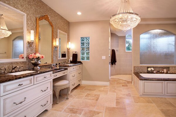 Gilded mirror on the background of a milk bathroom