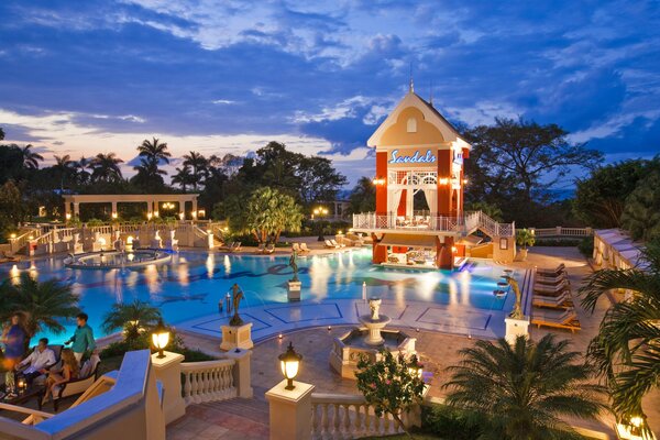 Hotel in the evening with a large swimming pool