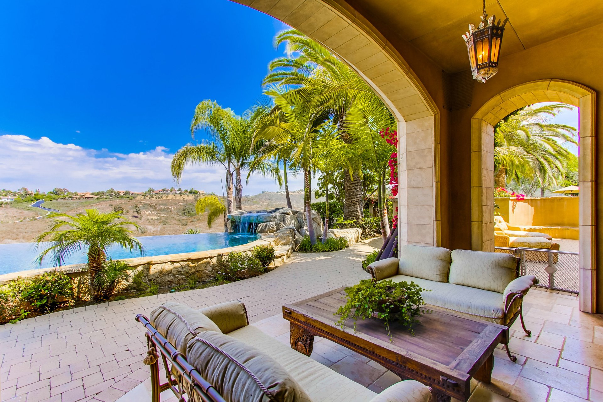 pool interior table sofas palm landscape