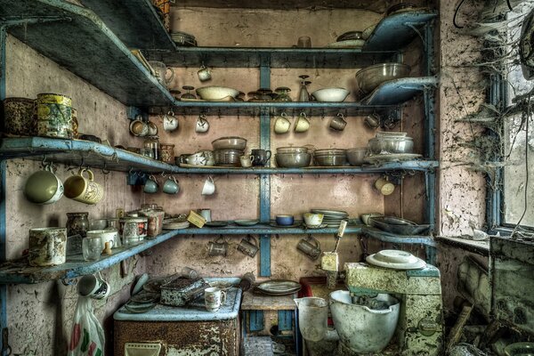 The cluttered kitchen is filled with all kinds of dirty dishes