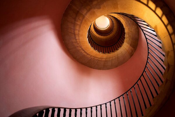 A view from below of a bright and unusual spiral staircase