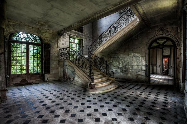 Stairs to rooms in an abandoned mansion