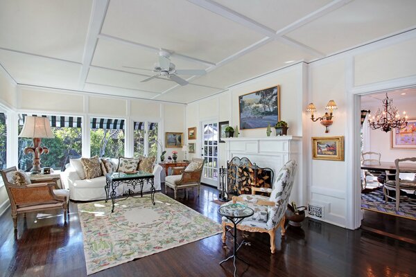 Bright luxurious interior of a room with a fireplace