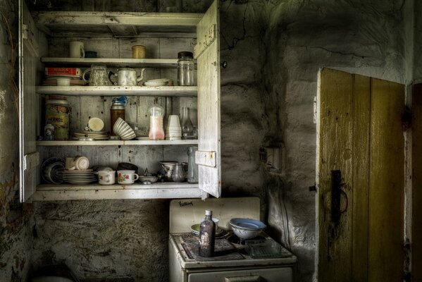 An old dining room with a gas stove and a wooden door