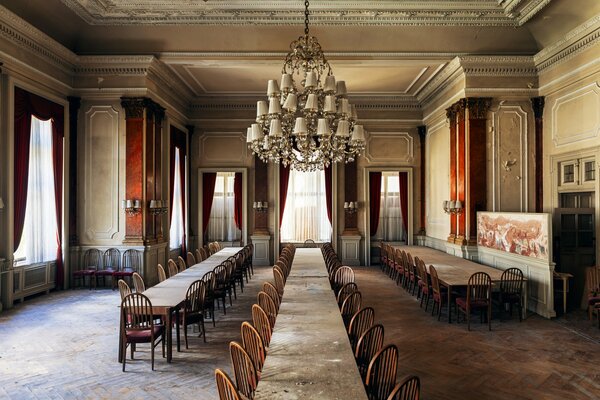 A room with a large table and chairs