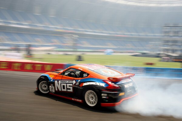 Skidding of a sports car in car racing and smoke