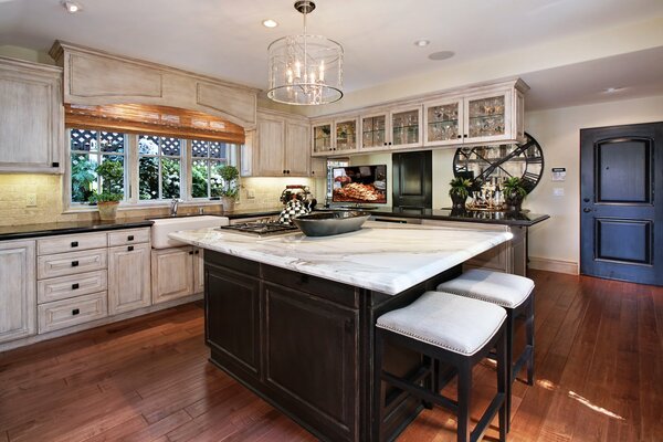 Cozy kitchen with island and bar area