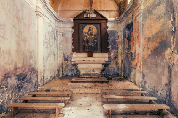 Old peeling church and altar