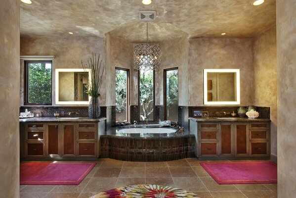 Large bathroom with bathtub and chandelier