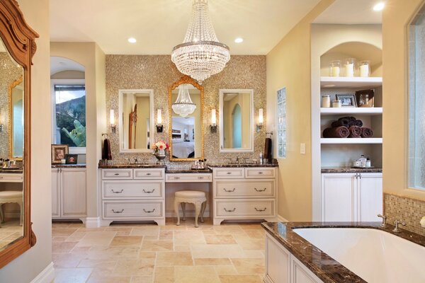 A stunning bathroom with a chic chandelier