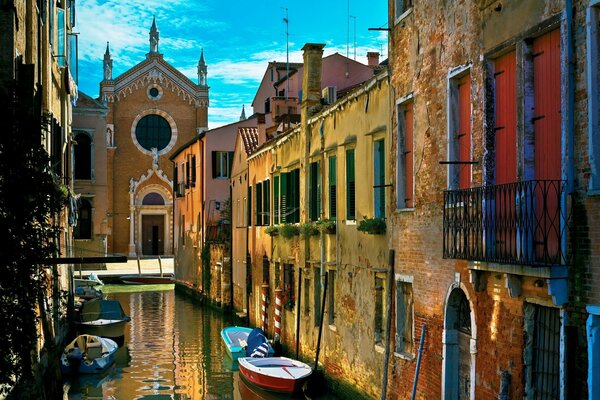 Old houses on the streets of the Venetian canals in Italy