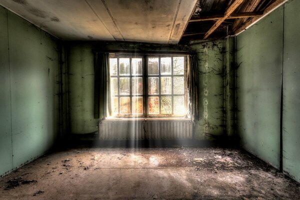 A dilapidated room without furniture