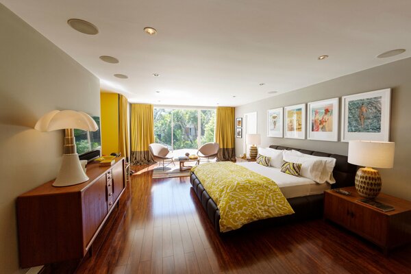 The interior of a bright bedroom. Furniture