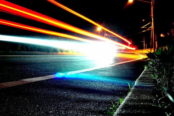 Blurred glare of headlights on the highway