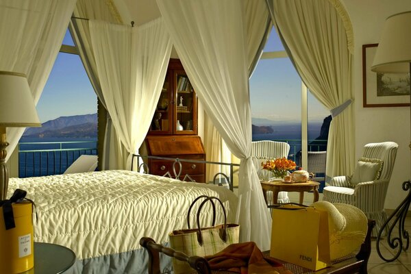 Bedroom interior on the background of mountains