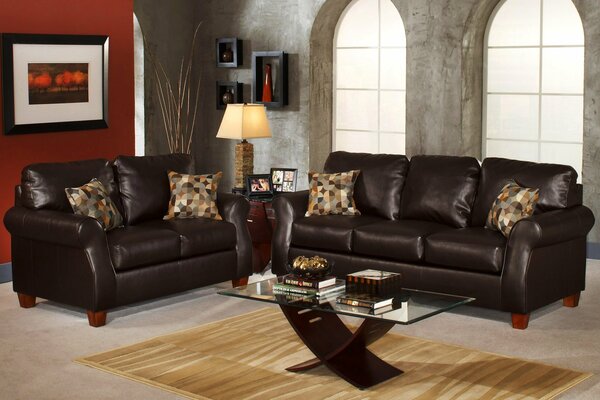 Living room with black sofas