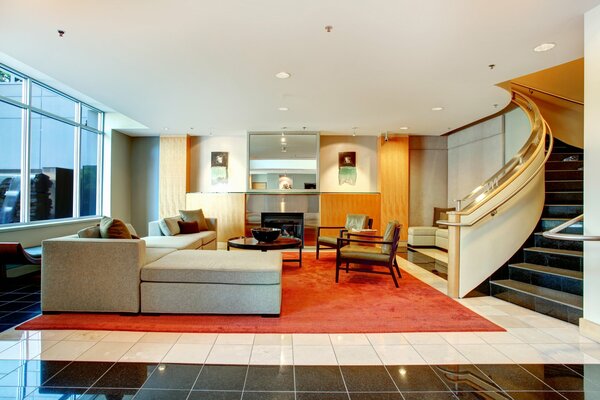 The interior of a spacious living room with a fireplace